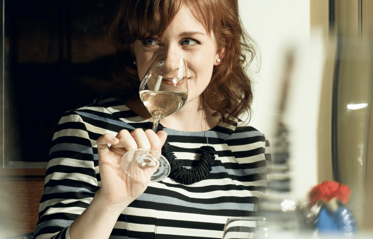 Laura Rhys sipping wine